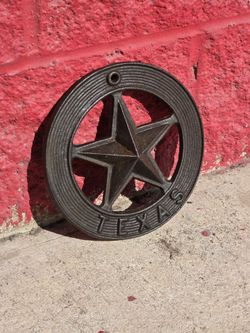 7" diameter cast iron Texas wall plaque with raised star and nail hole to hand, $15