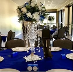 Tall centerpiece glass with hanging crystals and flower bowl on top for wedding and other occasions