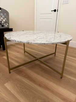 Round coffee table with faux marble