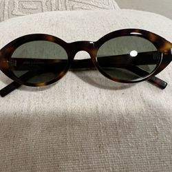 Saint Laurent SL 567 oval sunglasses in havana acetate
