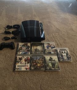PS3 with games and controller