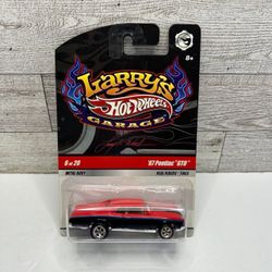 Hot Wheels Larry’s Garage Red / Black ‘1967 Pontiac / with Signature underneath • Die Cast Metal • Made in Malaysia   Metal Body  / Real Riders Tires