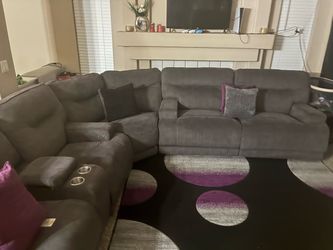Couch, rugs, and pillows