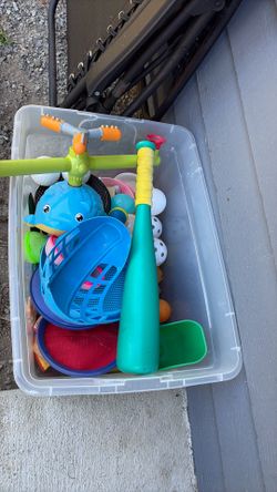 Tote full of kids summer toys and sprinkler