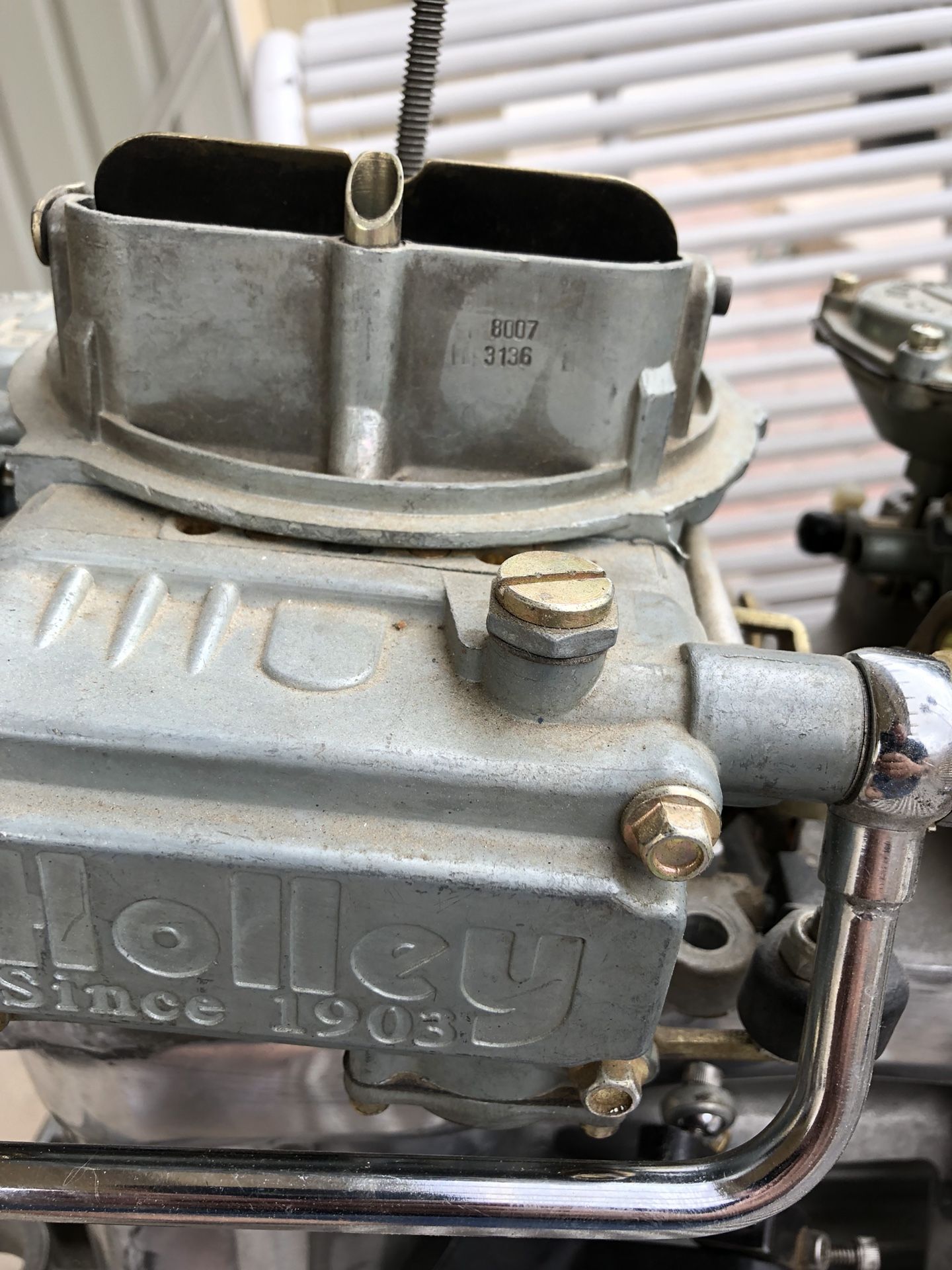 Edelbrock tunnel ram intake manifold with two holly carburetors for