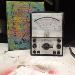vintage Micronta FET-VOM (Field Effect Transistor Volt-Ohm-Milliammeter), which is a type of high-impedance analog multimeter used for testing electri
