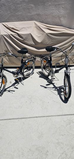 A pair  of PEUGEOT Folding bikes