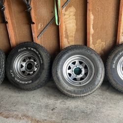 Four 15x7 Chrome Steel Wheels And Lug Nuts. 