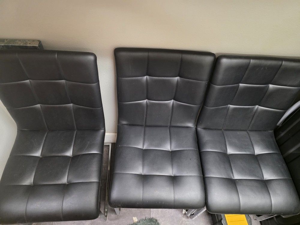 3 Black Leather Chairs , 3 Clear Chairs