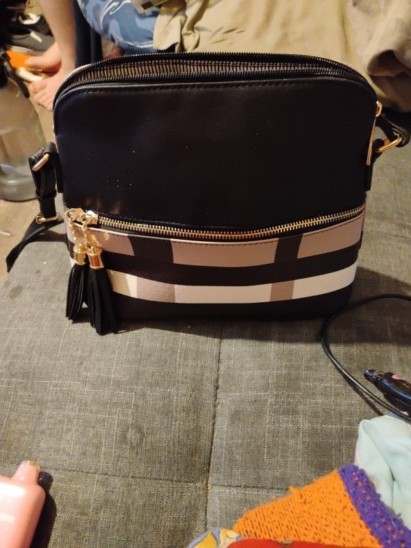 crossbody bag with tassels and plaid pattern