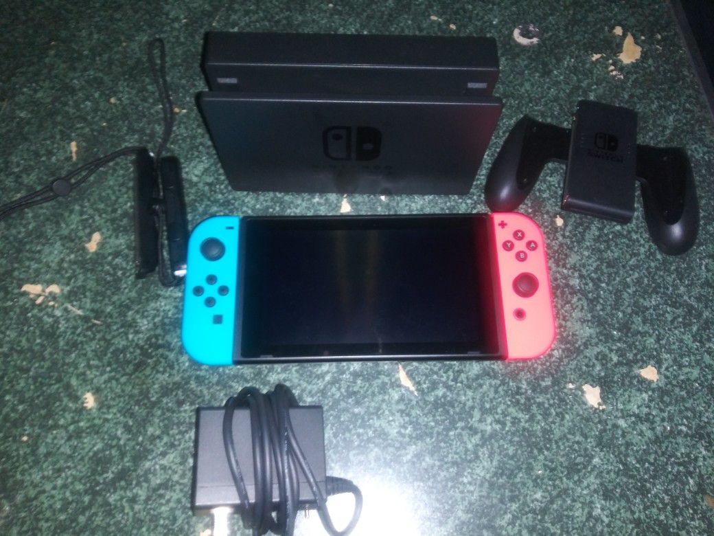Nintendo Switch/ w Neon blue and red JoyCons and the super Mario maker 2 game