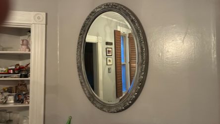 Oval Wall Mirror with Ornate Silver Frame