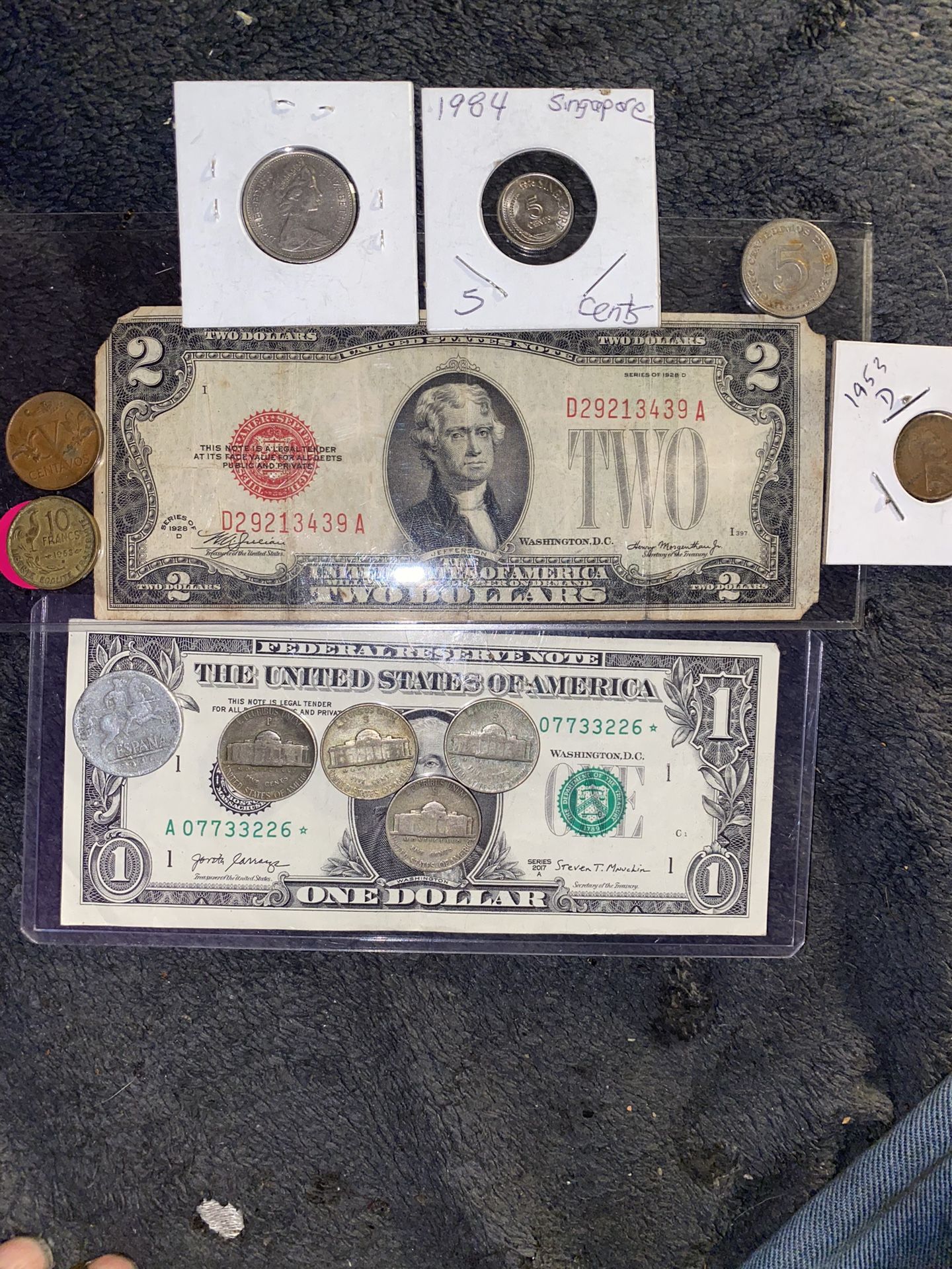 Two individual vintage bank notes 12 dollar red seal and one specialty serial number with star note some more nickels 1953 penny and some foreign coin