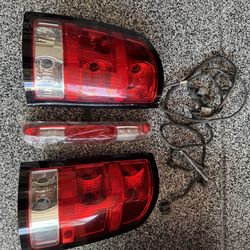 OEM GMC Sierra 2500 Tail Lights + 3rd Brake Light (2007–2014)
