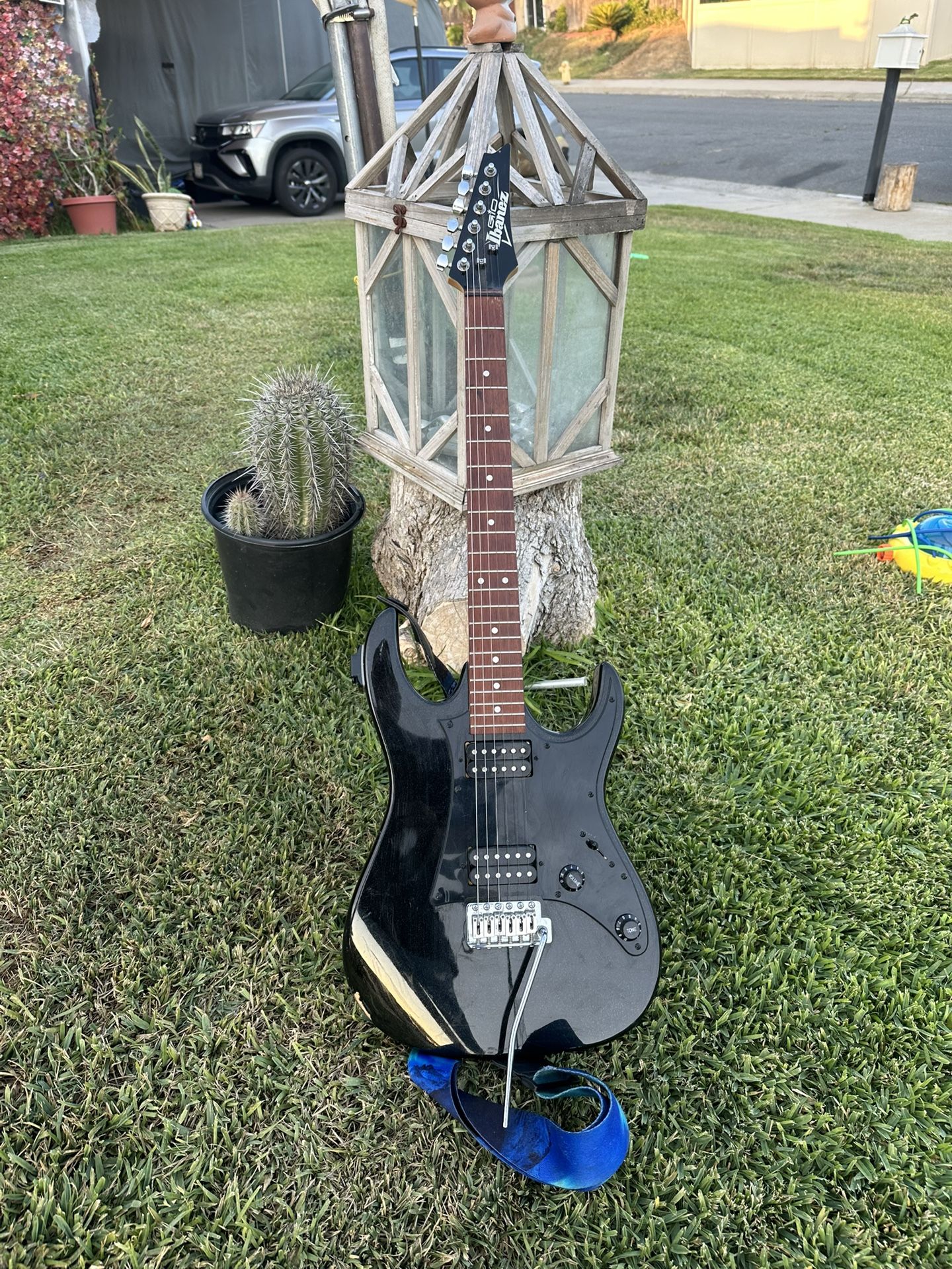GIO electric guitar, likely a GRX20Z model, identifiable by the "Ibanez GIO" logo on the headstock and its distinct body