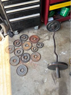 115 Lb Olympic Size Plates and curl bar