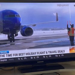 TV With Stand And Unused Sound Bar