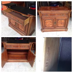 Bernhardt buffet server with beautiful wooden inlay has a flip top for further serving space, a silverware drawer and a storage cupboard