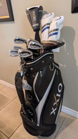 BRAND NEW XXIO EXPERIENCE THE DIFFERENT  MP1200 DRIVER SET/ MINT XXIO PRIME MP1200 IRON SET/ BRAND NEW XXIO CADDY CART BAG NEW ODYSSEY PUTTER