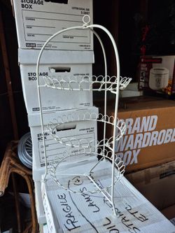 vintage three-tiered white metal wire serving tray

stand.