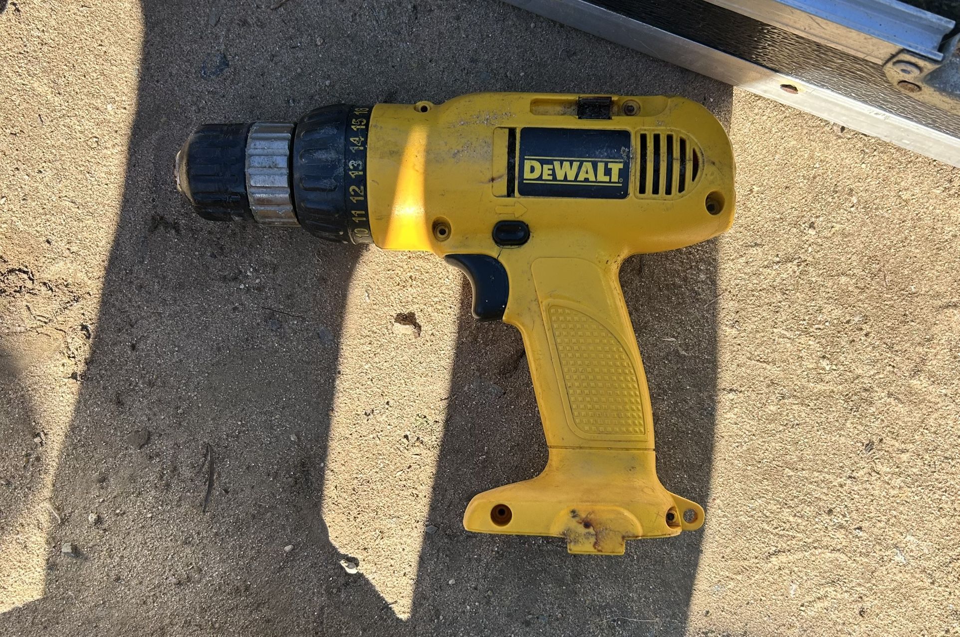 The item is a DEWALT DW953 12V 3/8" Cordless Drill Driver.