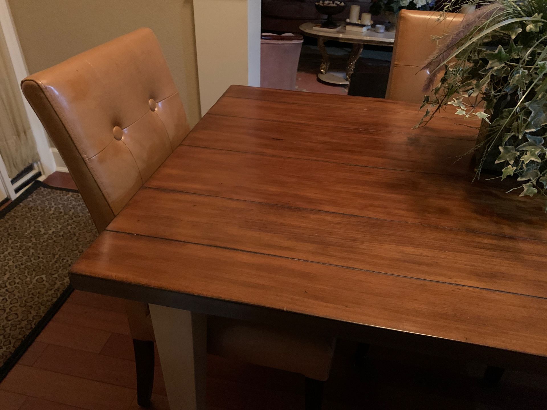 beautiful pier one dining table with 4 leather chairs in excellent condition