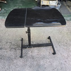 Adjustable rolling over-bed table in great condition.