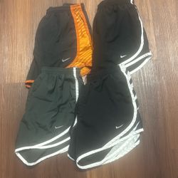 4 pairs of size small nike shorts 