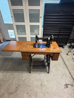 Antique White Treadle Sewing Machine with Ornate Oak Cabinet