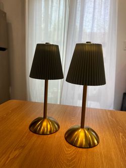 Two gold and green lamps