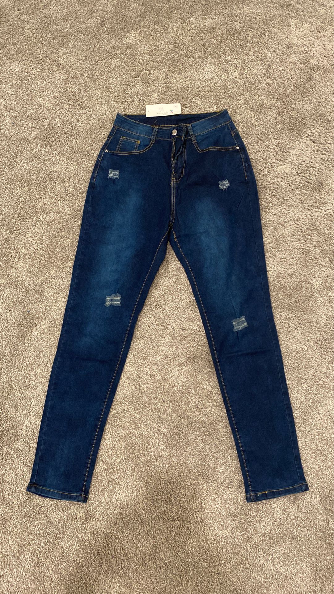 Dark faded wash skinny jeans, brand new never worn. Size Small.