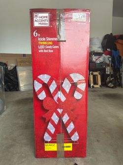 Christmas tinsel candy canes lawn ornament.