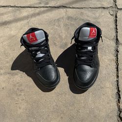 Black red and grey nike shoes