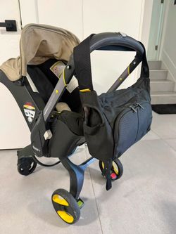 Doona Car Seat/Stroller – Edición Especial Pottery Barn Kids (Warm Stone) – Usado