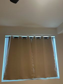Curtains with spring tension rod