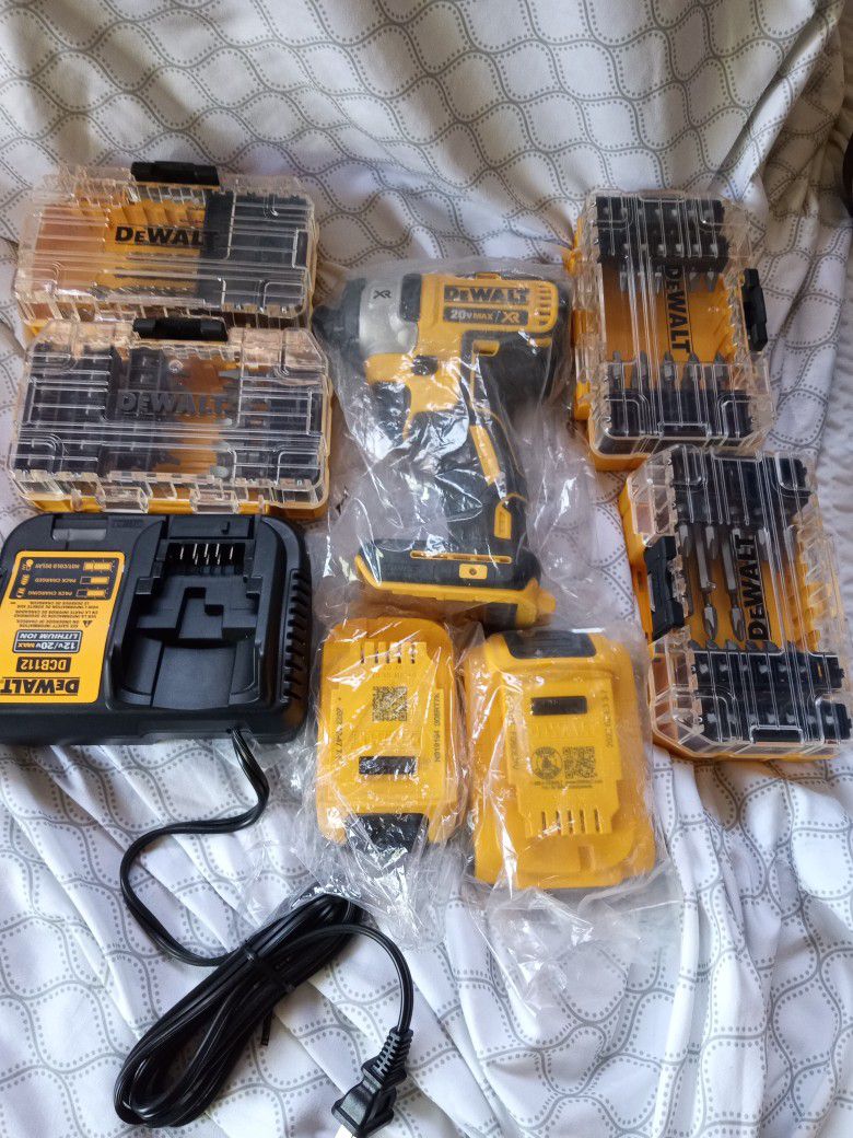 DEWALT IMPACT DRILL WITH 2 BATTERY'S , CHARGER & ALSO COMES WITH BITS ETC. 12V/20 BRUSHLESS BRANDNEW