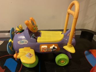 Winnie the Pooh toy car. With shapes and storage.