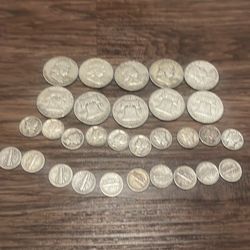 10 silver half dollars and 20 silver mercury dimes