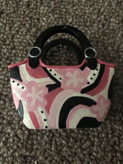 Pink/black business card holder.