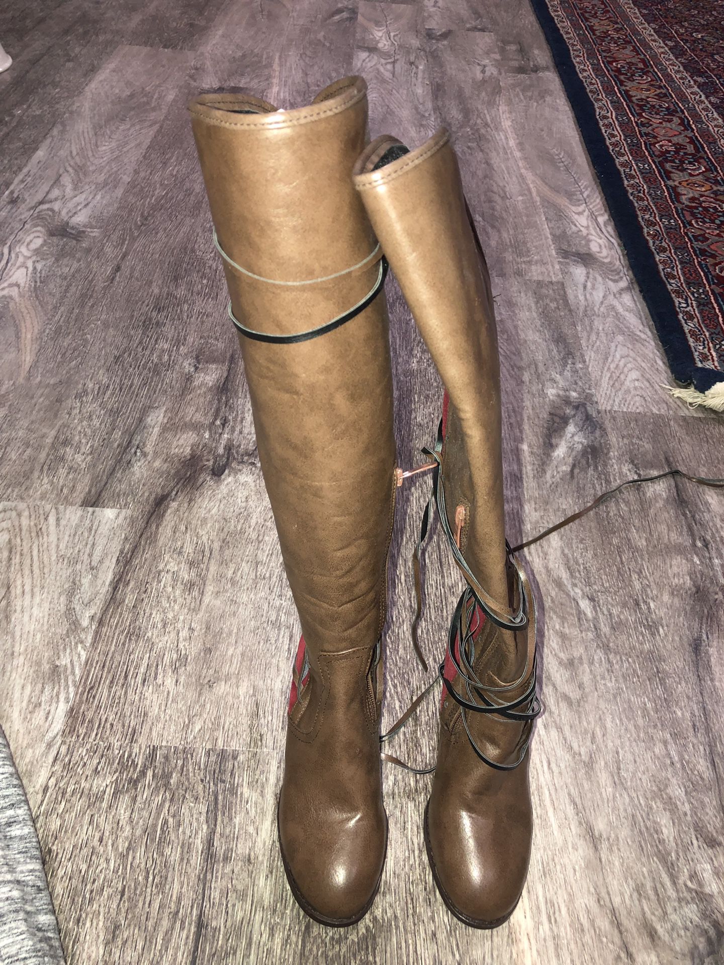 Knee high leather and suede boots