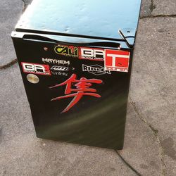 Mini fridge made by insignia it's rough looking but it works great used it in my shop $35