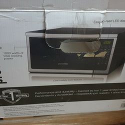 Proctor Silex 1.1 cu ft 1000 Watt Microwave Oven - (☝has Dents on the top)