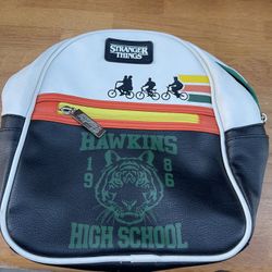 This is a Stranger Things Hawkins High School multi-colored mini backpack.  
