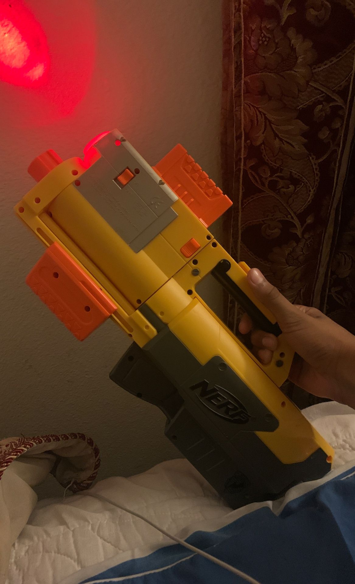 Nerf gun foldable with a light and cartridge.