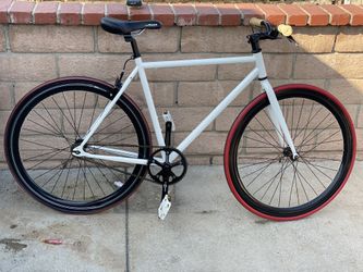 Fixie bicycle  Lasco crank set  Flip flop hub can ride on freewheel or fixed gear  Frame size 21 inches seat post to crank  700s wheel set deep V 