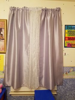 Purple and white curtains.