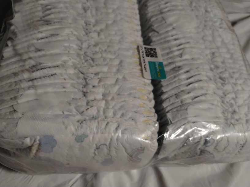 ~60 Newborn Diapers