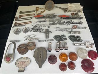 Vintage car parts emblems and glass lenses