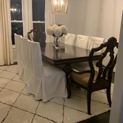Gorgeous Dining room Table w/ 8 Chairs, including Custom, white Chair Covers