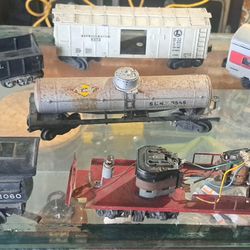 vintage Lionel model train cars and a locomotive. 